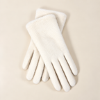 Paire de gants femme en peluche blanc cassé posée à plat