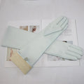 Gants cuir femme longs, coloris menthe, posés à plat