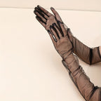 Gants longs femme transparents, paire posée à plat