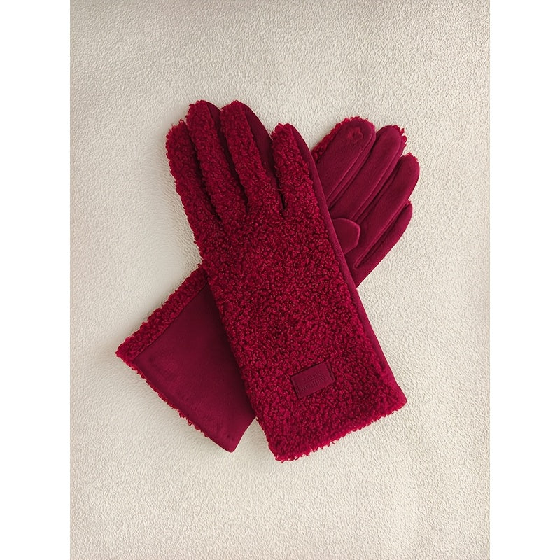 Paire de gants fourrure femme effet teddy rouges posés à plat